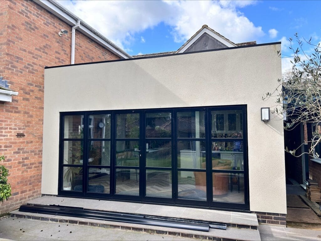 Completed rear extension with bi-fold doors in Bilton, Rugby